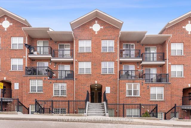 104 - 15 Strangford Lane, Townhouse with 2 bedrooms, 2 bathrooms and 1 parking in Toronto ON | Image 1