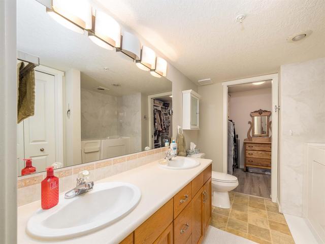 124 - 7229 Sierra Morena Boulevard Sw, Condo with 2 bedrooms, 2 bathrooms and 1 parking in Calgary AB | Image 19
