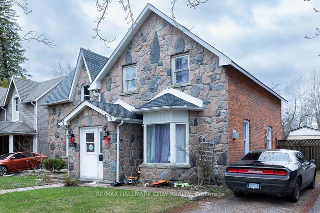 74 Queen St W, House detached with 1 bedrooms, 2 bathrooms and 4 parking in Springwater ON | Image 1