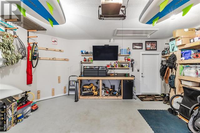 Garage with custom workbench and shelving | Image 23