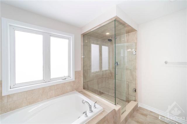 Soaker tub + tile & glass shower | Image 27