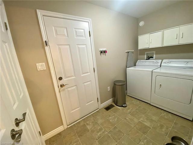 The main Floor laundry is off the kitchen | Image 7