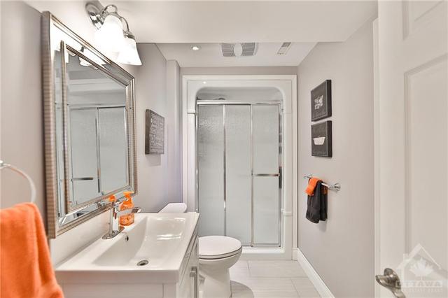 Full bathroom in the basement is perfect for older children or guests | Image 23