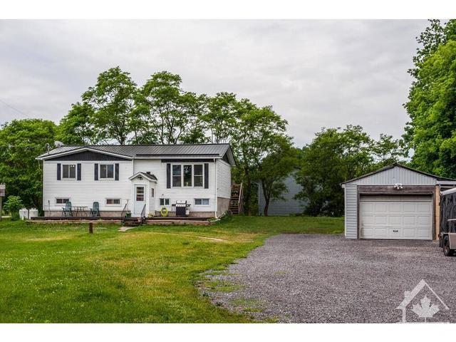 Situated on approx a half acre corner lot, this raised bungalow offers a country living lifestyle close to amenities! | Image 1