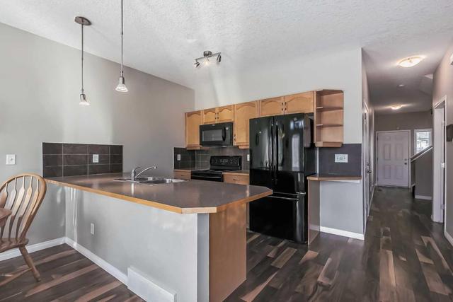 10 Everridge Gardens Sw, Home with 2 bedrooms, 2 bathrooms and 2 parking in Calgary AB | Image 6