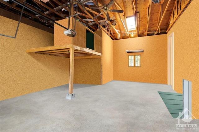 Oversized [22'10" X 26'9"] & extra high attached garage with direct access to the basement. *Photo has been virtually emptied to show the space. | Image 2