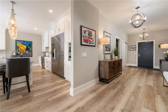 Large open foyer with luxury wide plan flooring throughout | Image 46