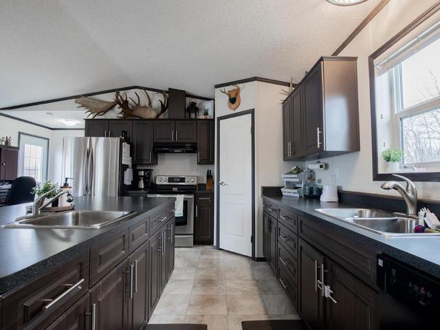 Kitchen offering large corner pantry and upgraded appliances | Image 24