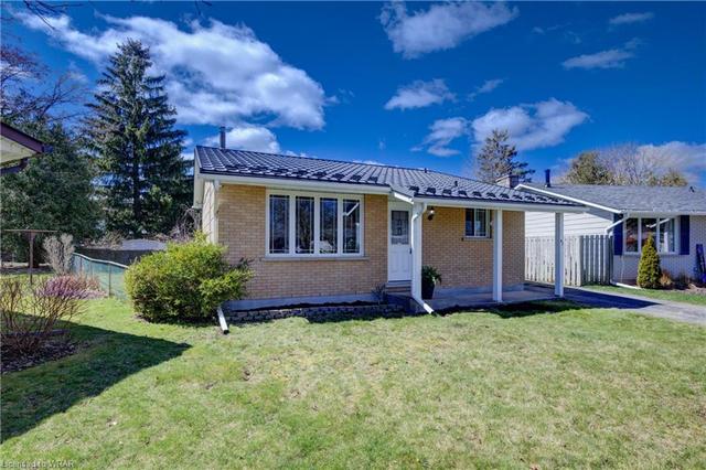Situated on a pie-shaped lot in a family-friendly neighbourhood, this sidewalk-free home features a deep driveway with ample parking for 3+ vehicles and a good-sized storage building, adding convenience and practicality. | Image 22