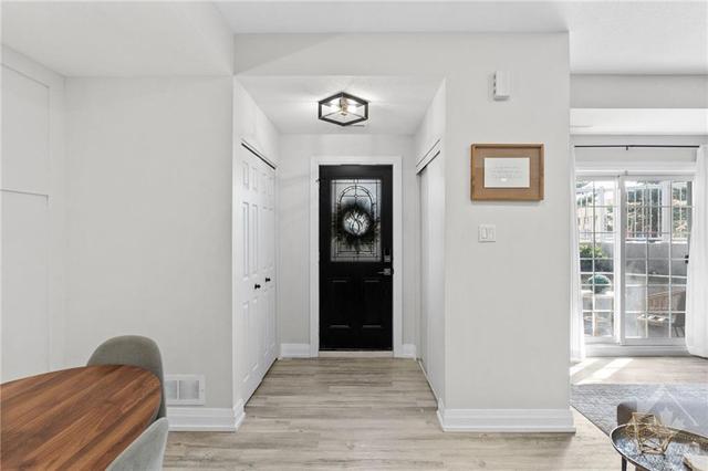 Front foyer w/ closet on one side of the door & Utility Area and additional storage on the other side. | Image 7