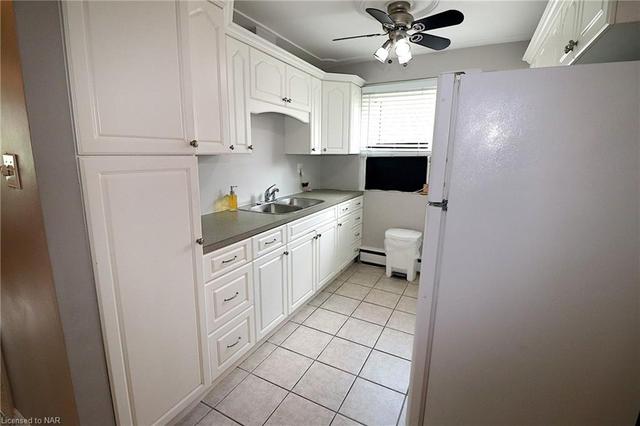 Kitchen includes Built in Microwave, Fridge and Stove. The AC unit belongs to the Tenant. | Image 7