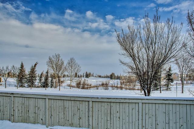 80 Crystal Shores Cove, Home with 3 bedrooms, 2 bathrooms and 2 parking in Calgary AB | Image 47