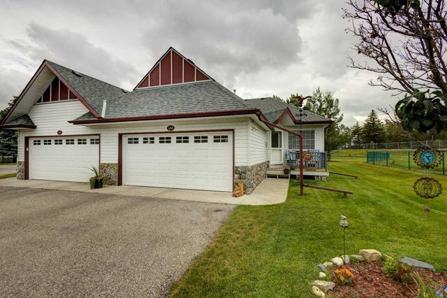 144 Baker Creek Drive Sw, Home with 4 bedrooms, 2 bathrooms and 4 parking in High River AB | Image 1