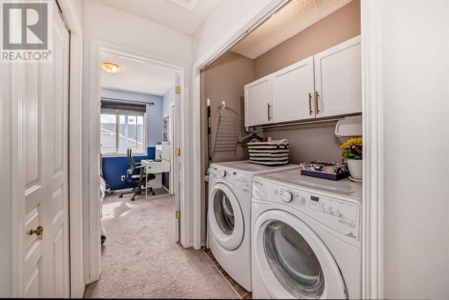 Upper floor laundry with added cabinets | Image 29
