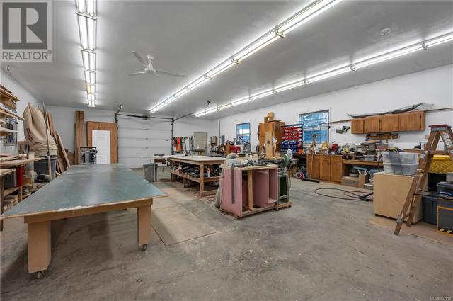 Workshop 30’ Wide x 70’ Long – 10’ Height •Fully Finished inside with 4 inch Concrete Slab Floor •Pro Lock Metal Roof  & Leaf Guard Gutters in Sept 2020 •WETT Certified Woodstove (Nov 2020) and | Image 85