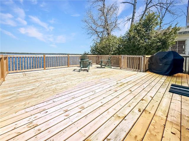 Spacious deck overlooking the river is perfect  for entertaining | Image 21