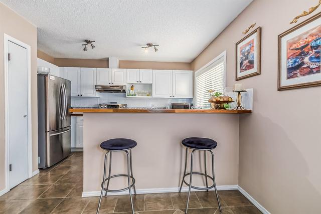 19 Millrose Place Sw, Home with 3 bedrooms, 2 bathrooms and 2 parking in Calgary AB | Image 5