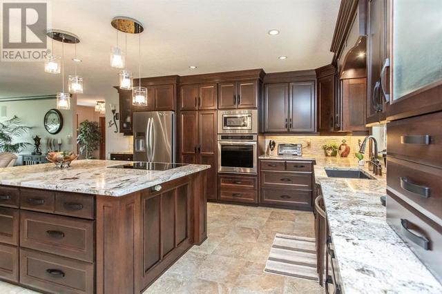 Upgraded stainless appliances and a large island for entertaining | Image 7