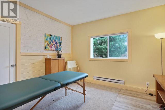 Seller currently uses 2 rooms for a massage studio but could be an in-law suite or mortgage helper | Image 19