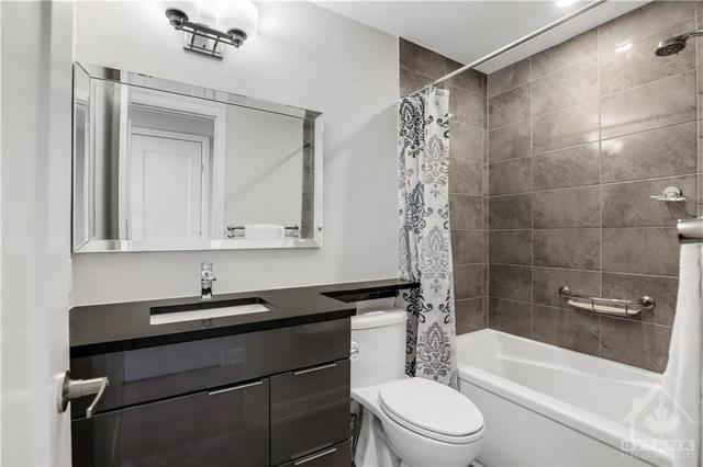 The 2nd full bathroom on the 3rd level features high quality finishes and quartz counters | Image 19