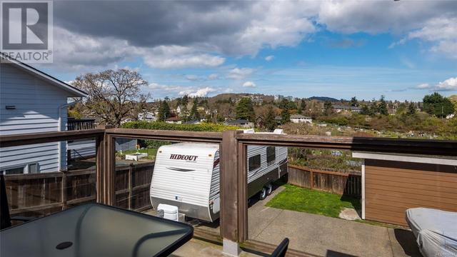 Main floor deck looking out to Swan Lake & Mt Doug | Image 11