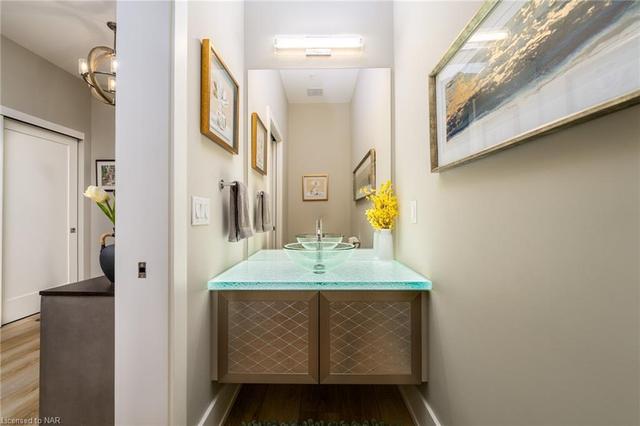 Foyer two-piece powder room with upgraded contemporary glass countertop-CBD Glass Studios | Image 45