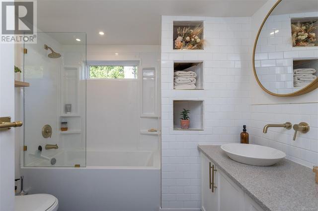Spa inspired renovated bathroom with modern fixtures, new tile and relaxing soaker | Image 23