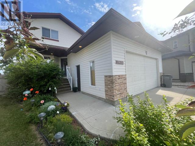 13035 88a Street, House detached with 4 bedrooms, 3 bathrooms and 4 parking in Grande Prairie AB | Image 1