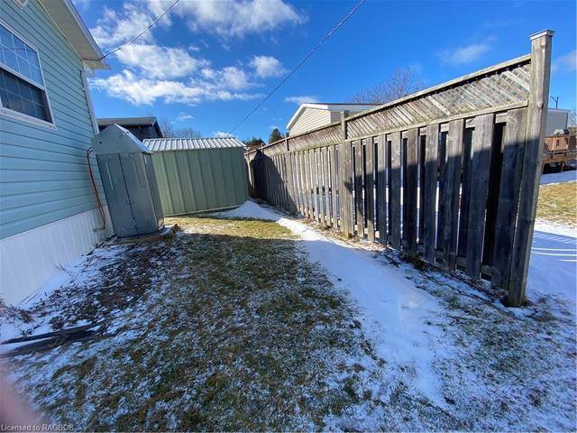 Partial wood fence at rear of property. | Image 13