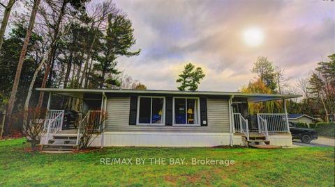 141 Madawaska Tr E, Home with 2 bedrooms, 2 bathrooms and 2 parking in Wasaga Beach ON | Card Image