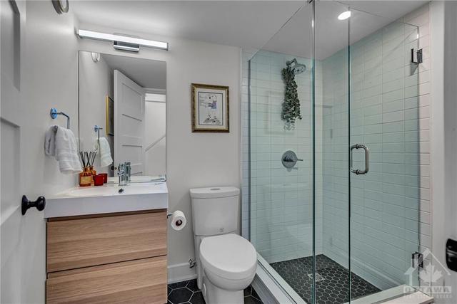 Full bathroom in the basement. There is sump pump in the small closet across from the shower because they dug down the basement and this bathroom is below the original service line. There is also | Image 13