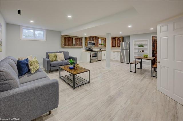 The walk-out basement with open-concept living/dining plus a full kitchen, features 2 bedrooms and would be an ideal in-law suite. | Image 18