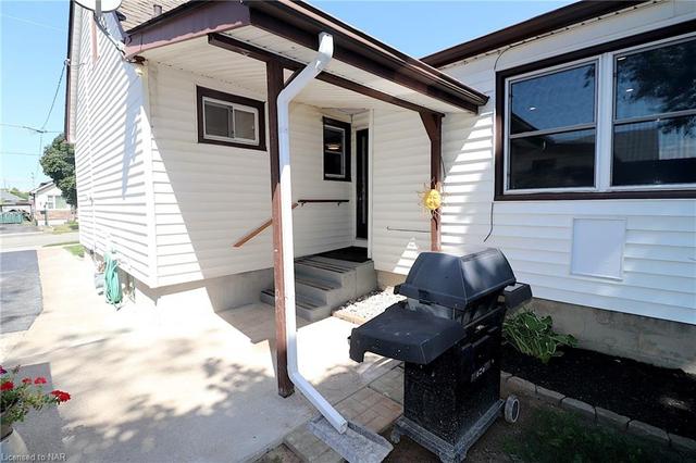 Side Entrance has a Covered Porch | Image 28