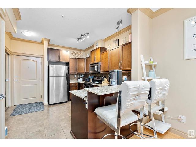 227 - 10121 80 Av Nw, Condo with 2 bedrooms, 2 bathrooms and 2 parking in Edmonton AB | Image 11