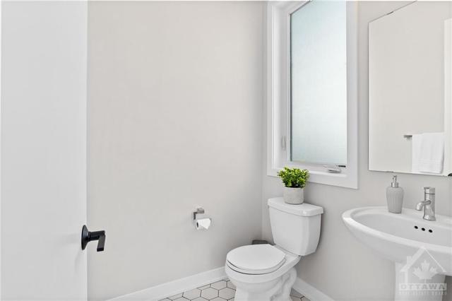 Front powder room. Located off Foyer. | Image 5