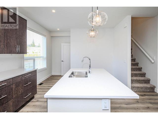 123 - 610 Academy Way, House attached with 3 bedrooms, 3 bathrooms and 2 parking in Kelowna BC | Image 4