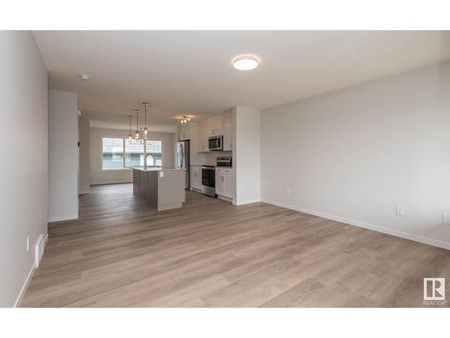 5702 Juchli Av Nw, House attached with 3 bedrooms, 3 bathrooms and null parking in Edmonton AB | Image 3