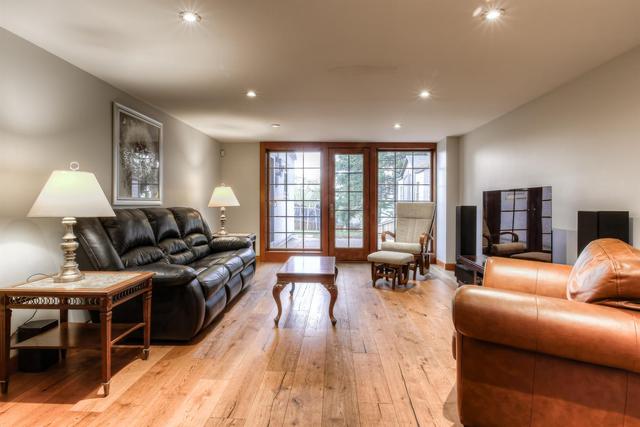 The lower level has been tastefully renovated with a bright and beautiful family space including large windows and doors to walk out into the backyard | Image 33