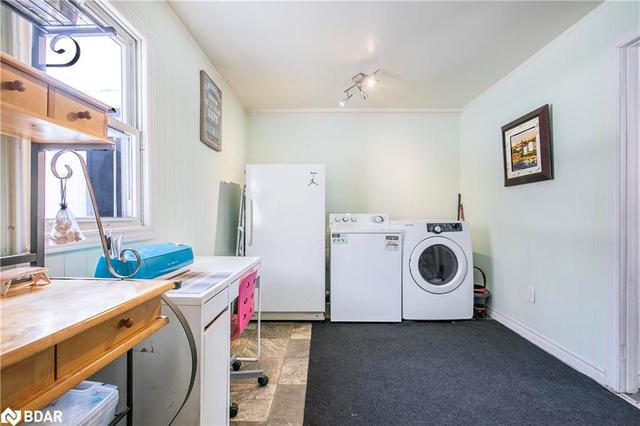Primary bedroom with 2-p ensuite currently being used as laundry/storage | Image 2