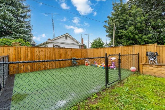 Rear yard access via the patio doors - the gates in the fence open for ease of access to the rear yard for gardening etc. | Image 28