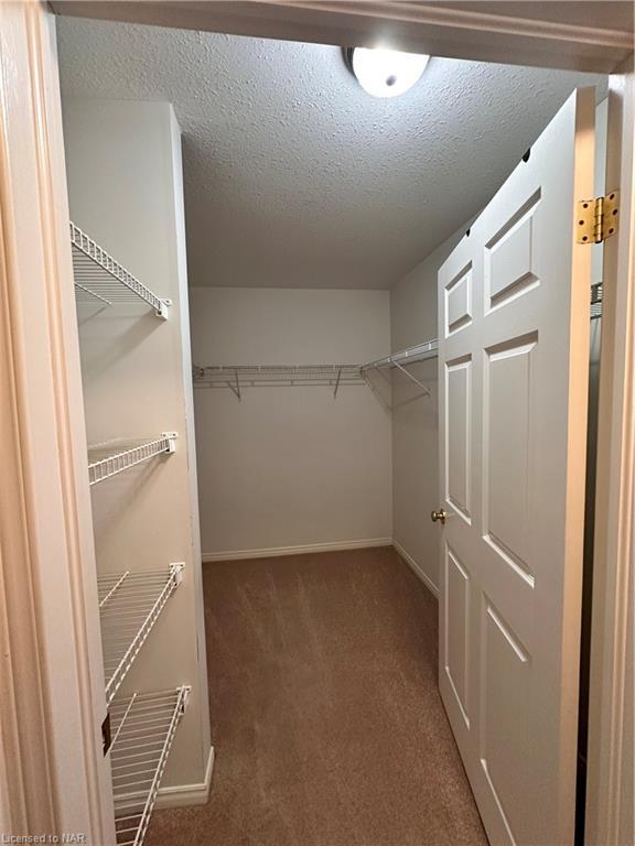 The primary bedroom also offers a good sized walk-in closet! | Image 17