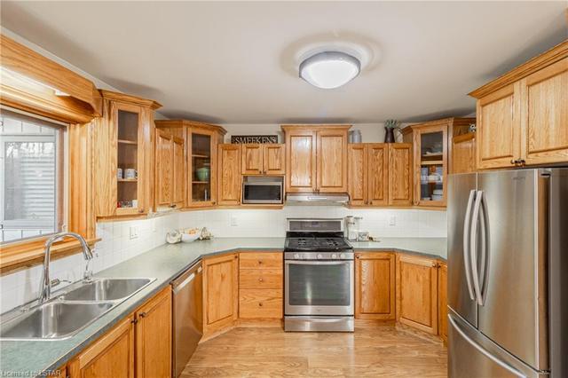 Your main level laundry / mud room & inside entry from garage w/ coat closets & updated washer & dryer (included) + gas service if you were to ever wish to upgrade to a gas dryer. | Image 15