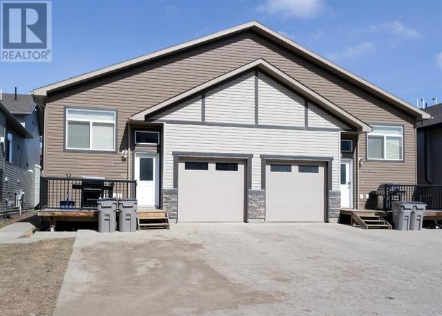 11322 105 Avenue, House semidetached with 4 bedrooms, 4 bathrooms and 4 parking in Grande Prairie AB | Card Image
