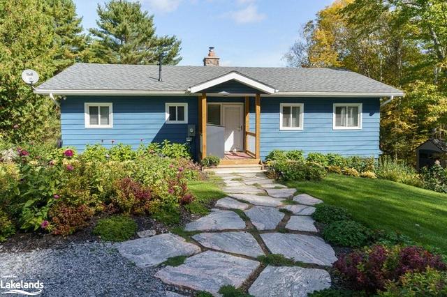 Beautiful perennial gardens and granite landscaping adorn this gorgeous property! | Image 23