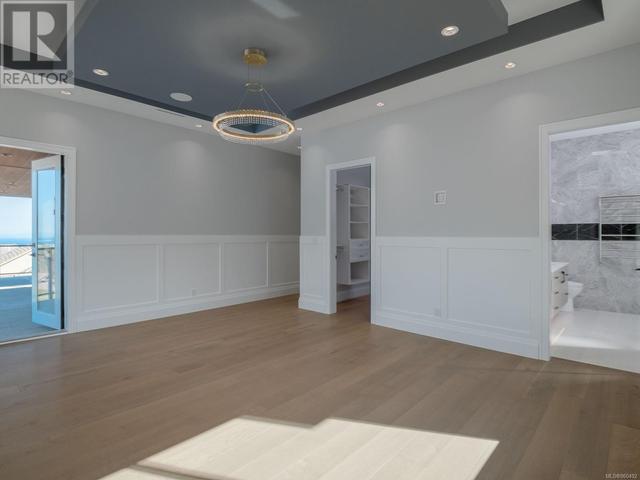 Master bedroom with door going out to balcony | Image 44