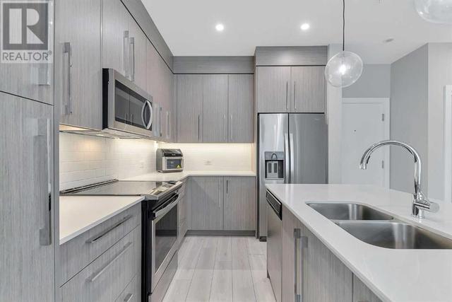 205, - 383 Smith Street Nw, Condo with 2 bedrooms, 2 bathrooms and 1 parking in Calgary AB | Image 8