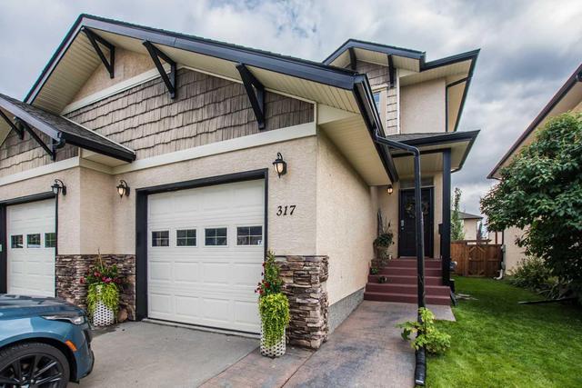 317 Addington Drive, Home with 4 bedrooms, 2 bathrooms and 1 parking in Red Deer AB | Image 1