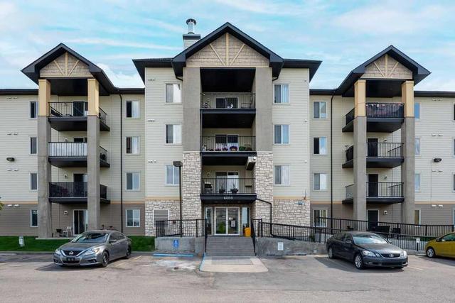 6114 - 304 Mackenzie Way Sw, Condo with 2 bedrooms, 2 bathrooms and 2 parking in Airdrie AB | Image 1