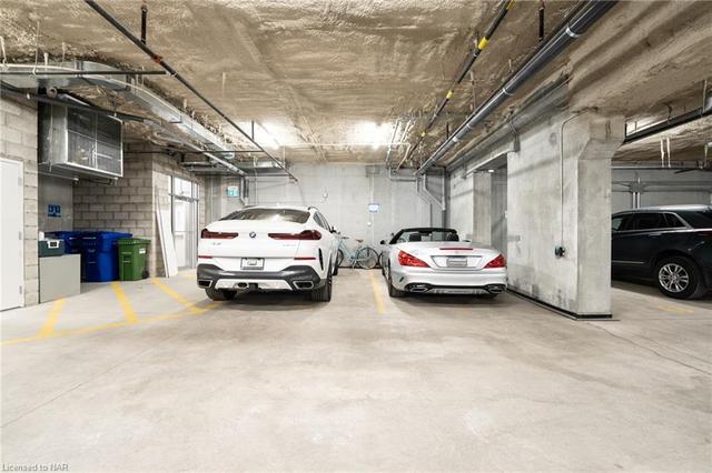 Two owned parking spaces with roughed in EV charger | Image 33
