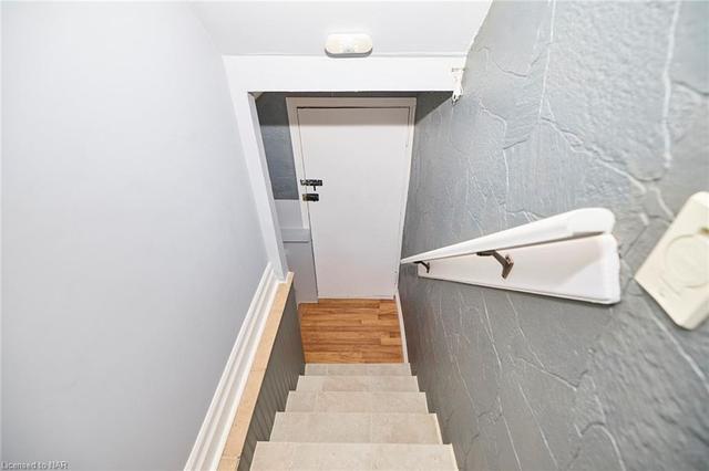 Unit #1 stairs to basement | Image 18